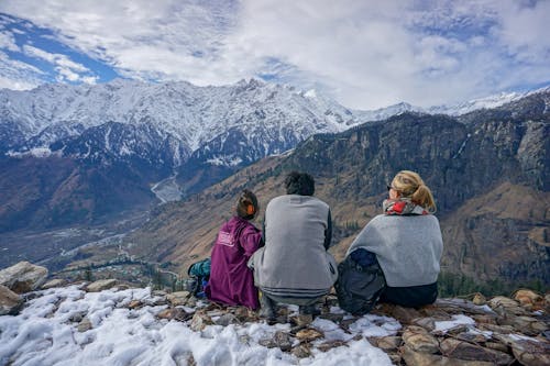 Family enjoying a view in the mountains