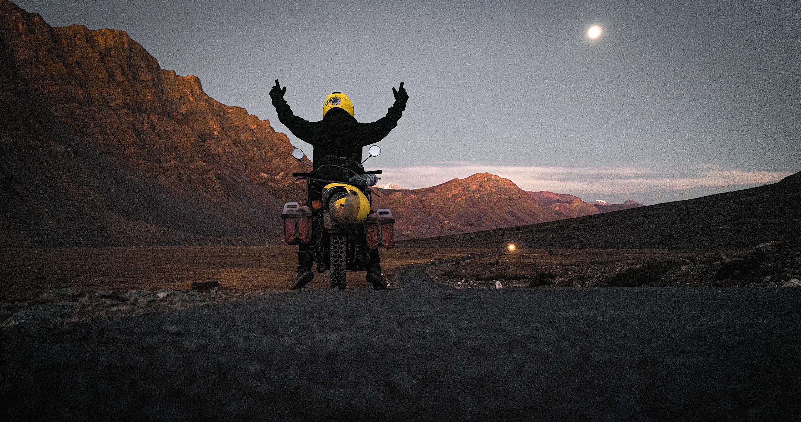Solo traveler on a motorcycle in the Himalayas